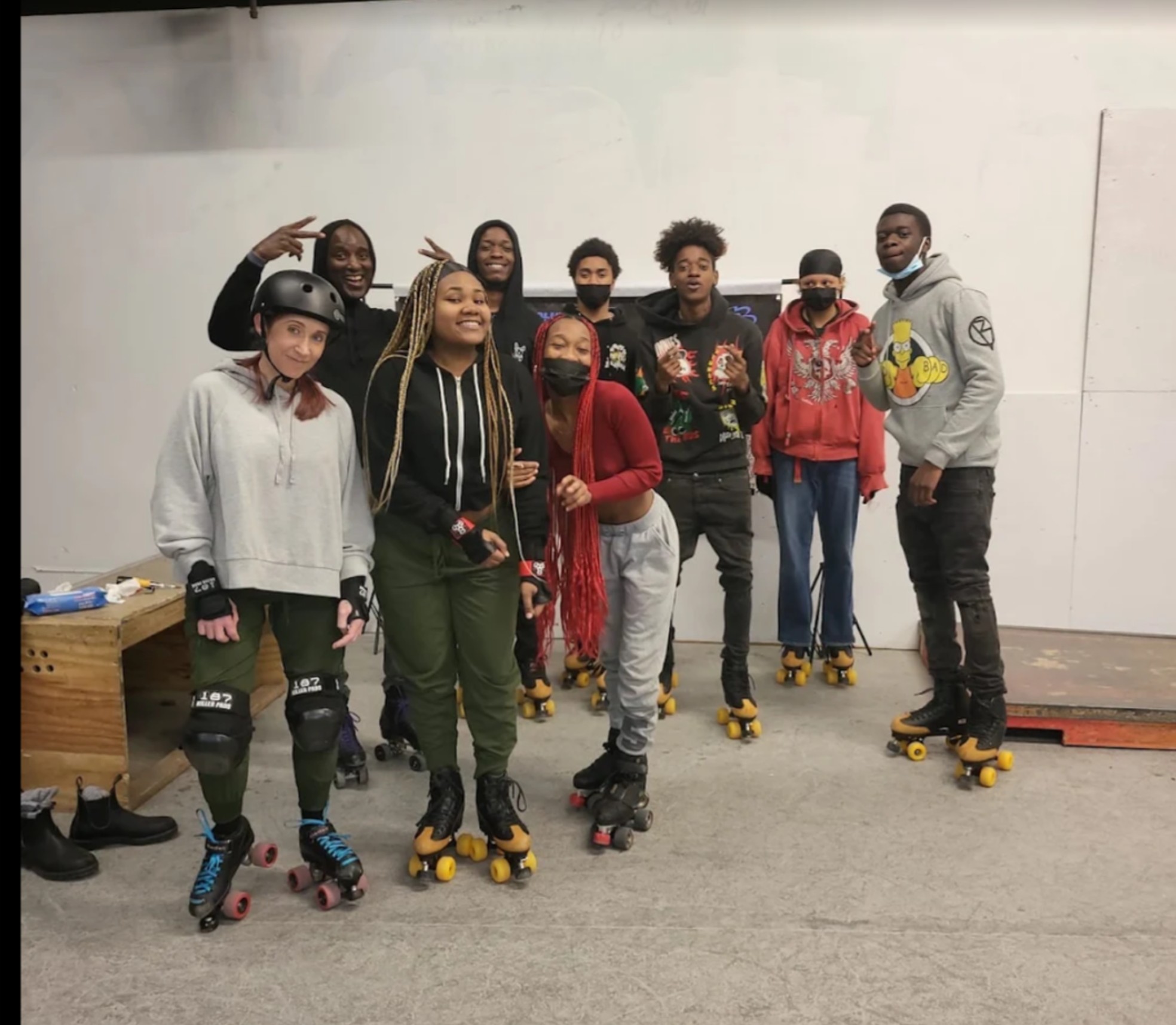 Blue Skate interns roller skating together outdoors